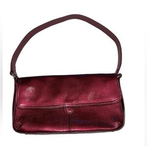 HOBO international handbag in a metallic wine with gold interior colorway. O